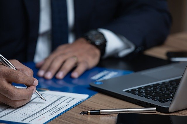 lawyer signing documents